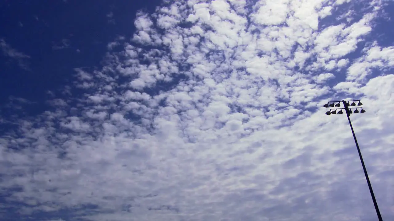 Time lapse clouds passing over a football field