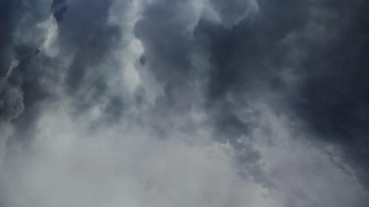 4k thunderstorm cumulonimbus clouds moving in dark sky