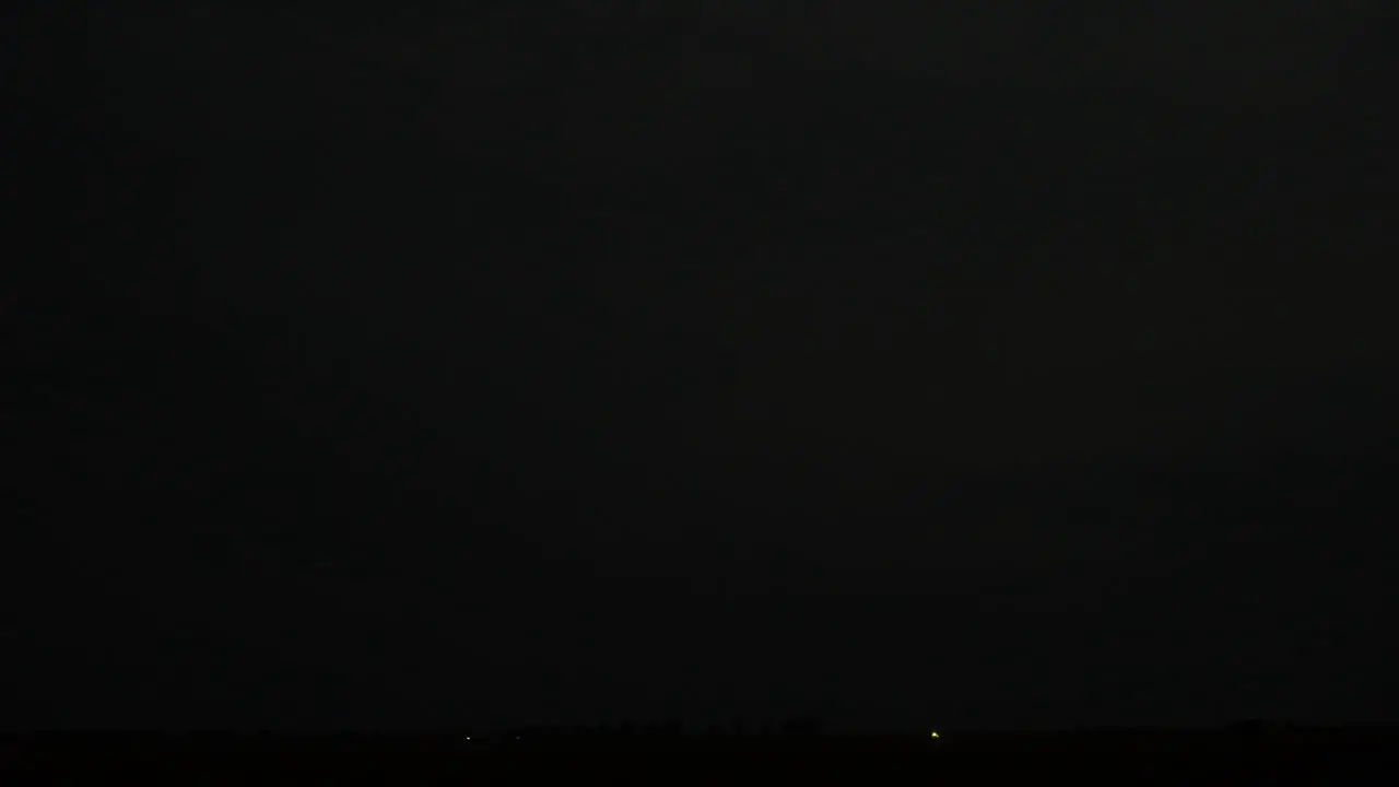 Dark sky and flashing lightning during South East Asia monsoon season