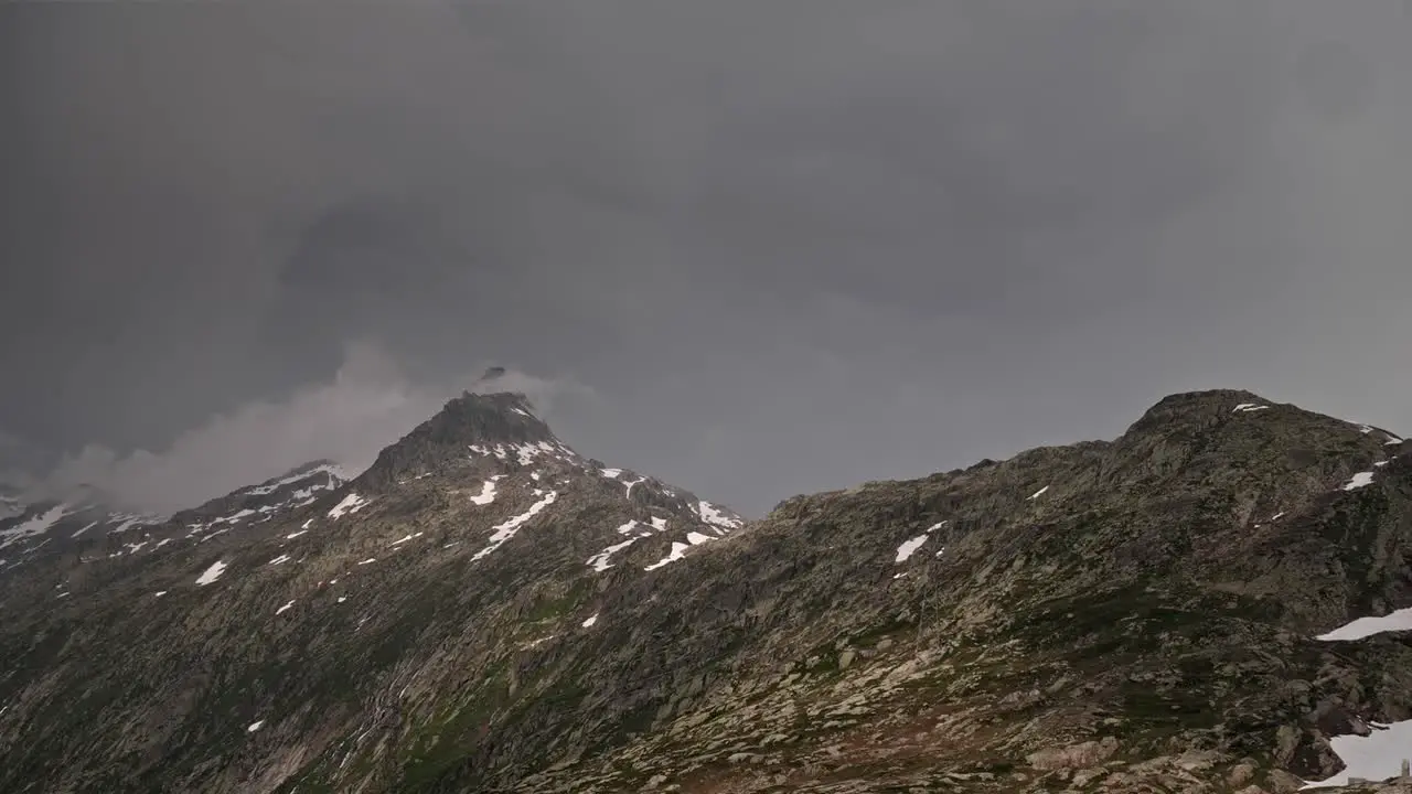 Timelapse of dramatic stormy clouds over alpine peaks