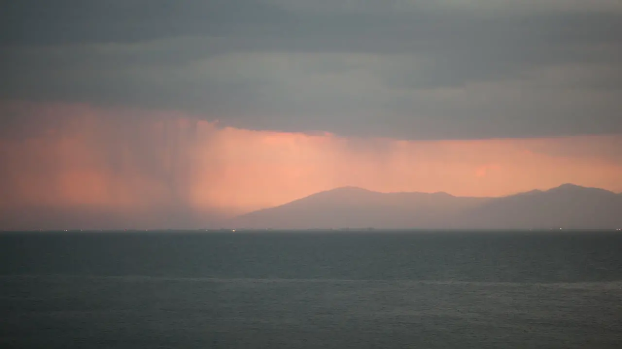 Timelapse of pouring rain over the sea