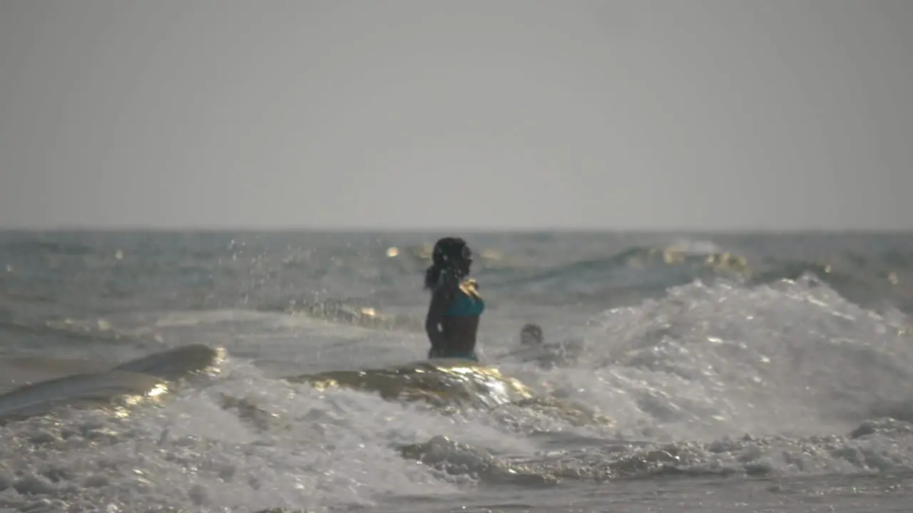 Gran Canaria island Spain view of woman silhouette against stormy Atlantic Ocean