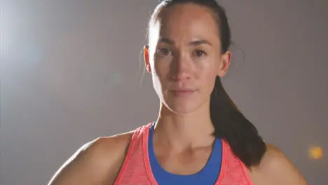 Close Up Shot of Young Woman Turning to Camera at Gym