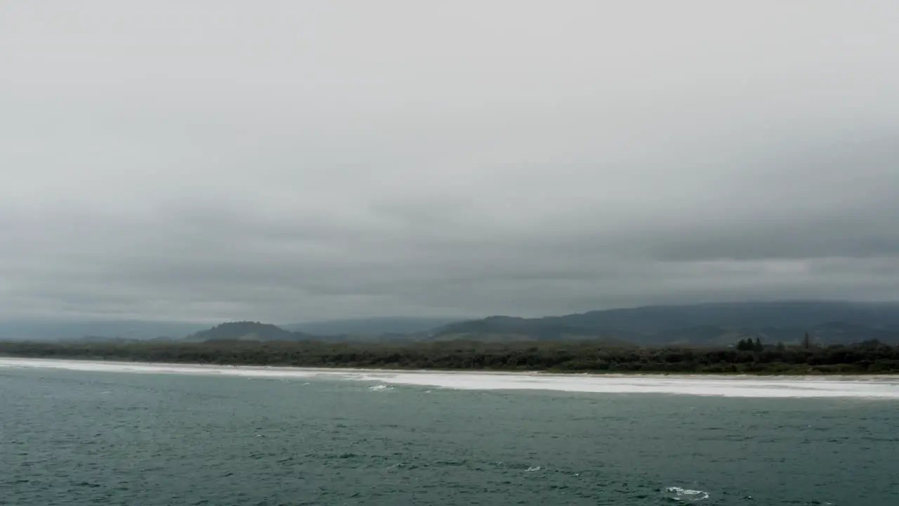 Aerial drone shot of Seven Mile Beach on a stormy day in the south coast of NSW Australia