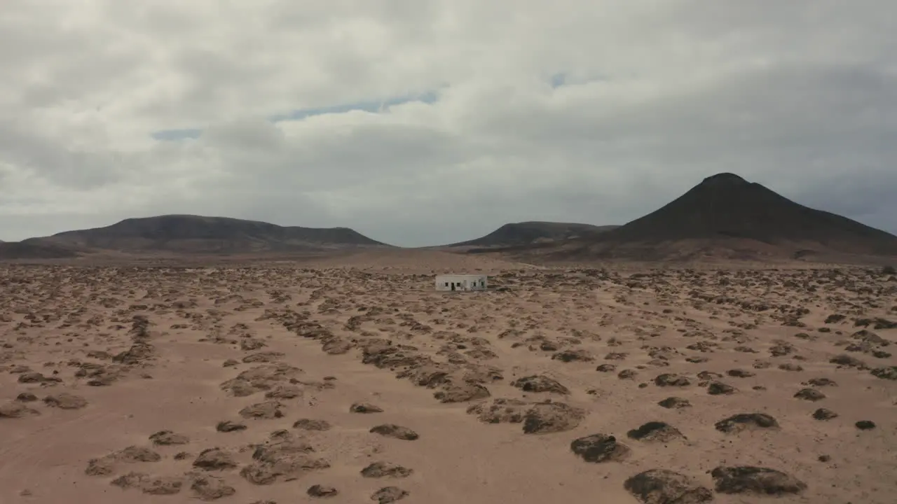 Drone shot of an abandonned house in the middle of a desert in Fuerteventura