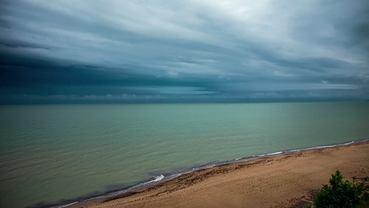 Dark Seas Timelapse of Ominous Dark Clouds and Rain over Beach and Ocean