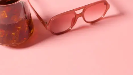 Summer Holiday Concept Of Sunglasses Cold Drink On Pink Background