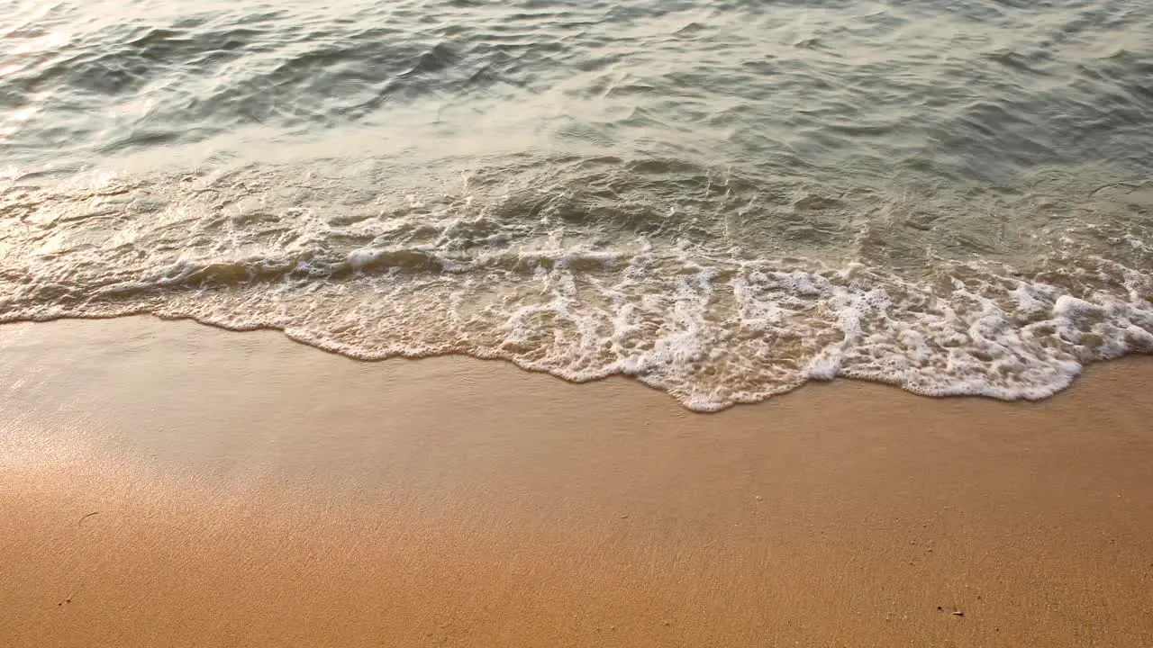 Ocean Waves Crash on the Sandy Beach in Pattaya Thailand