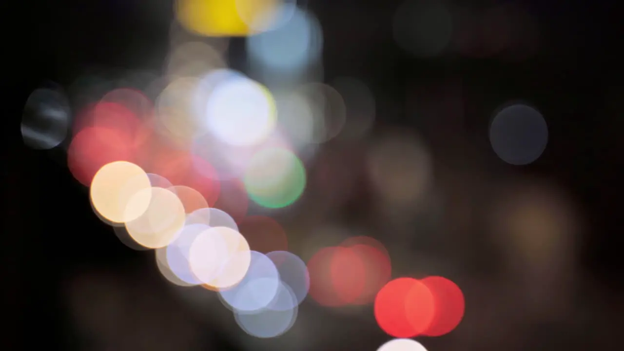 Beautiful glittering bokeh in dark blurry background at night