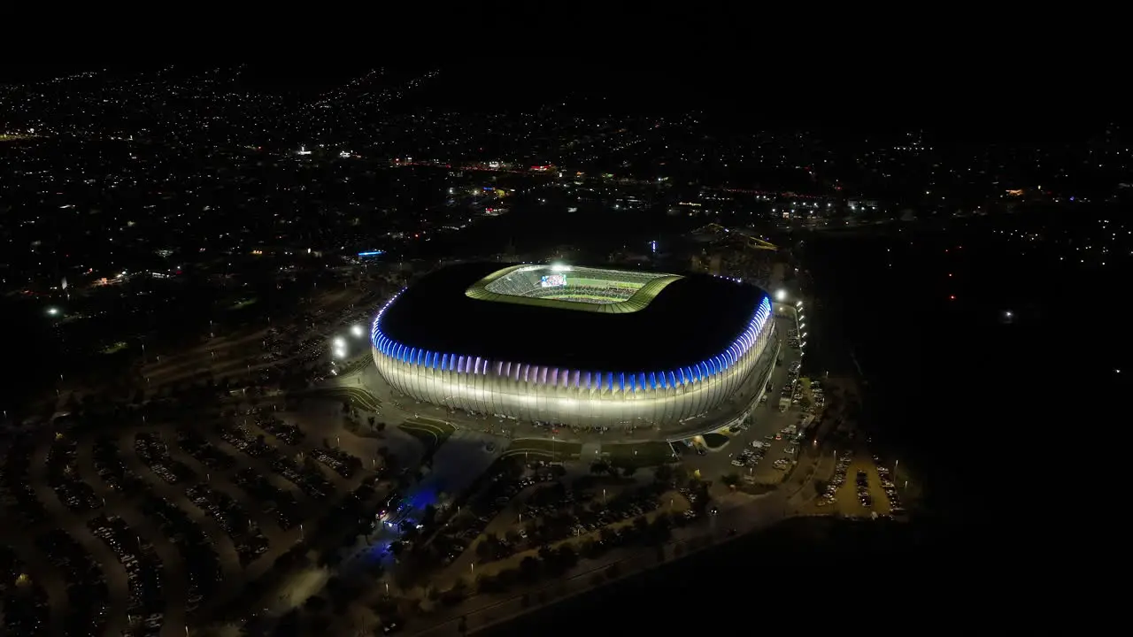 Aerial view around the Estadio BBVA stadium night in Monterrey Mexico orbit drone shot