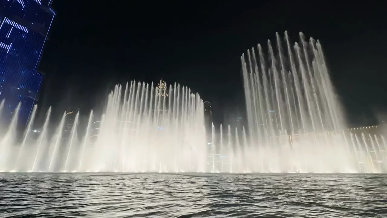 The Dubai Fountain show in the artificial Burj Khalifa Lake nighttime time lapse