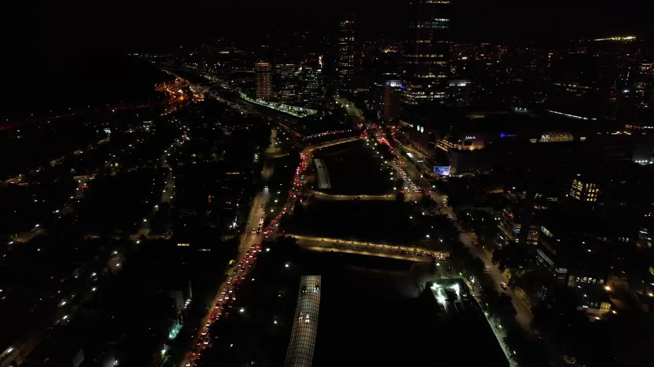 Santiago de Chile Avenue at Nighttime Aerial Drone Above Main Road Cars Traffic Night Lights of the Metropolitan Town near Andean Cordillera