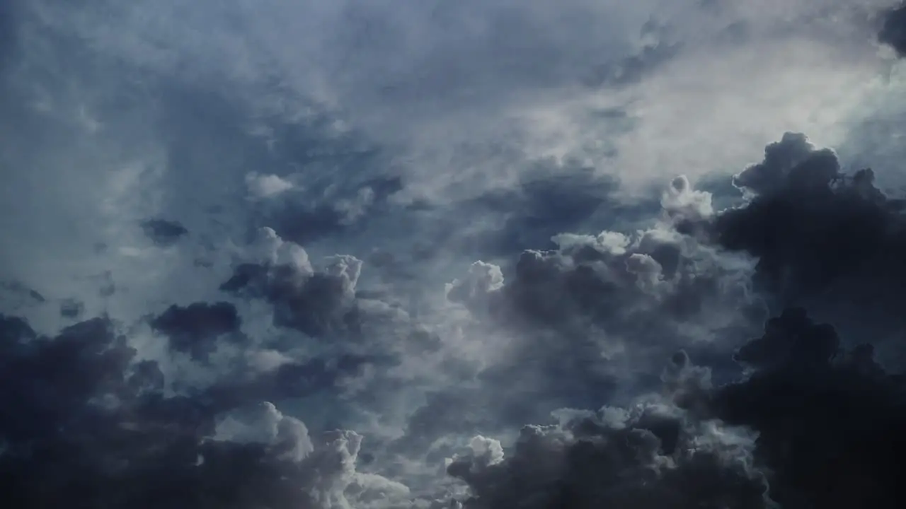 4k thunderstorm clouds in the sky moving with lightning strike