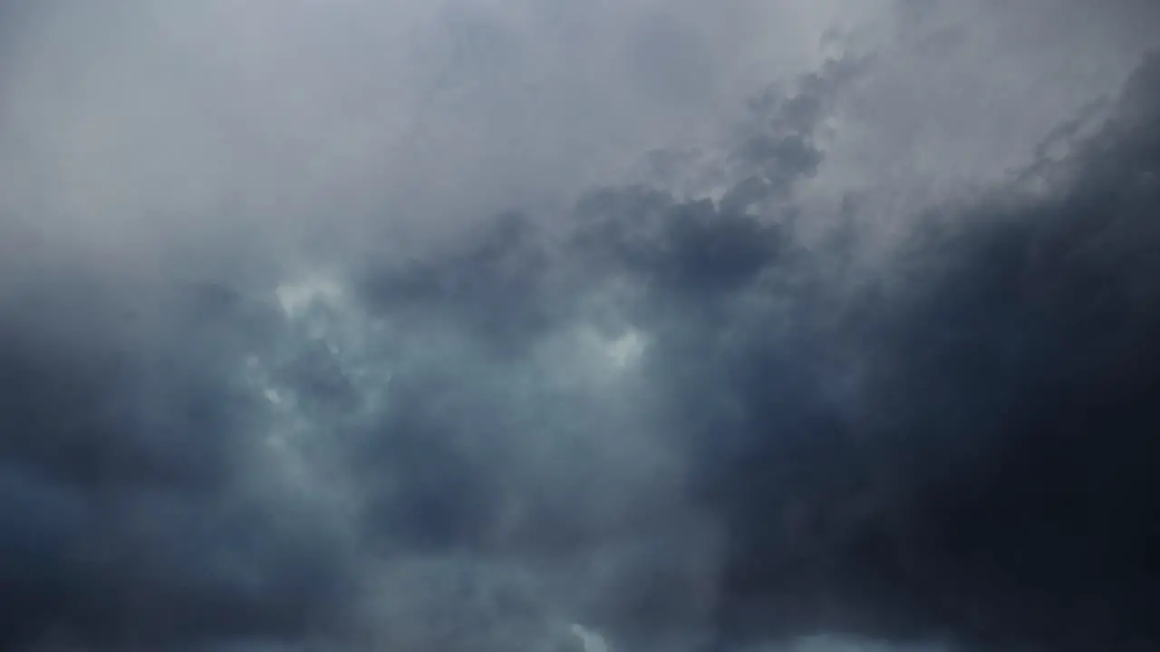 4k thunderstorm flying through in dark sky and moving clouds