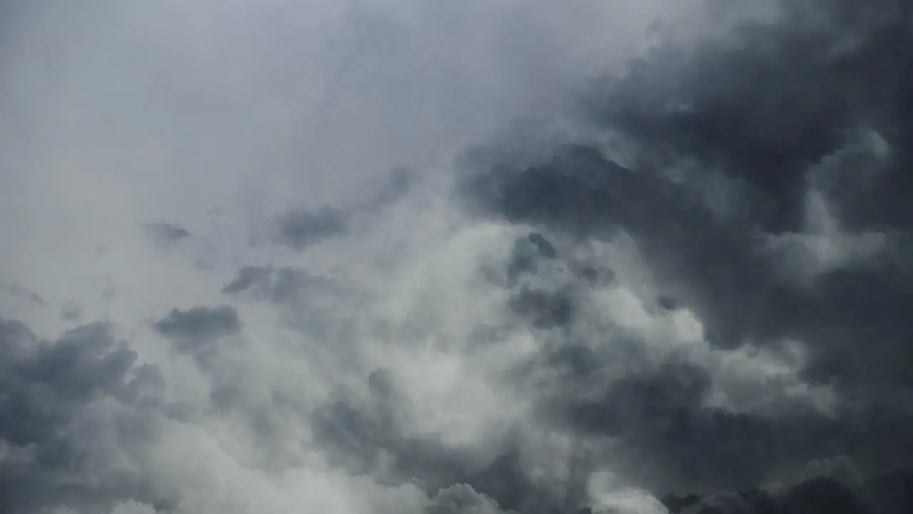 4k thunderstorm cumulonimbus clouds in the sky moving with lightning strike