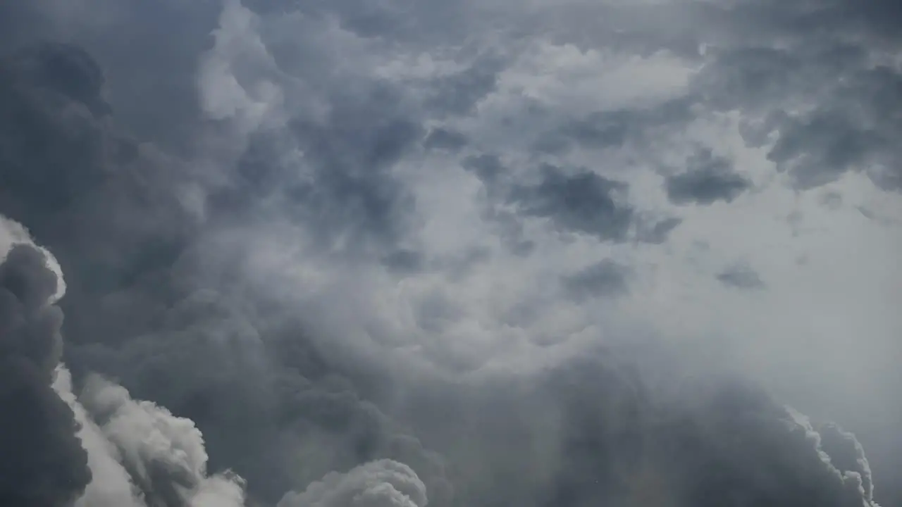 4k thunderstorm lightning strike behind dark clouds moving in the sky