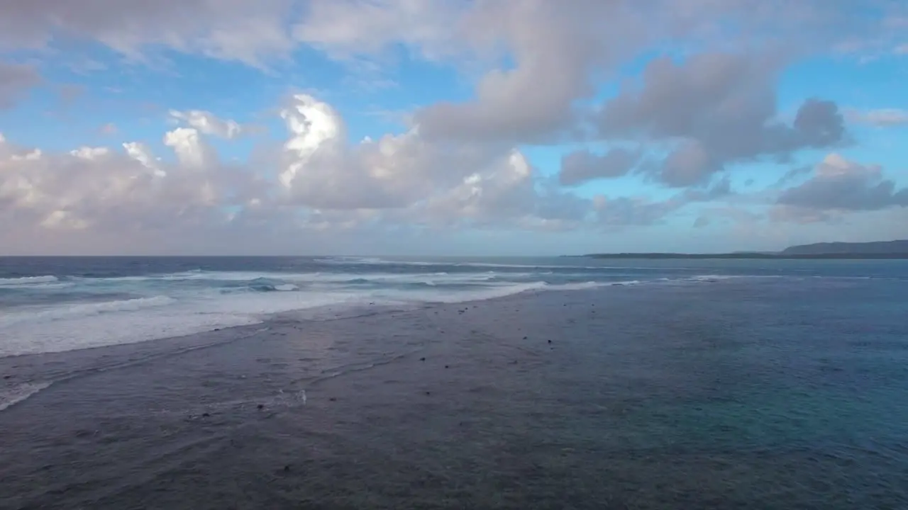 Aerial view of water line of seas that do not mix against blue sky with clouds Mauritius Island