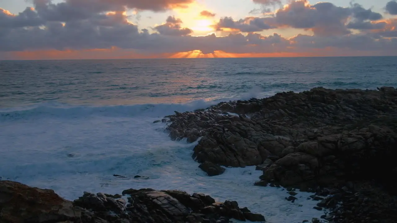 light rays at sunset over the ocean at Injidup beach Western Australia