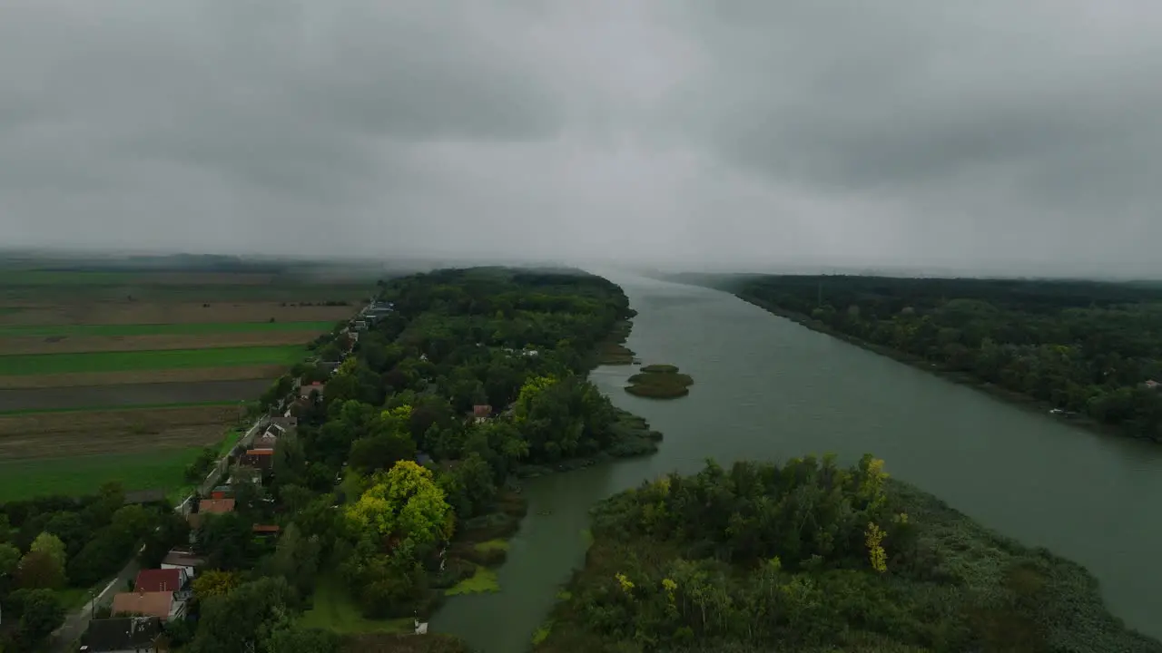 Flying over a river while the storm is coming