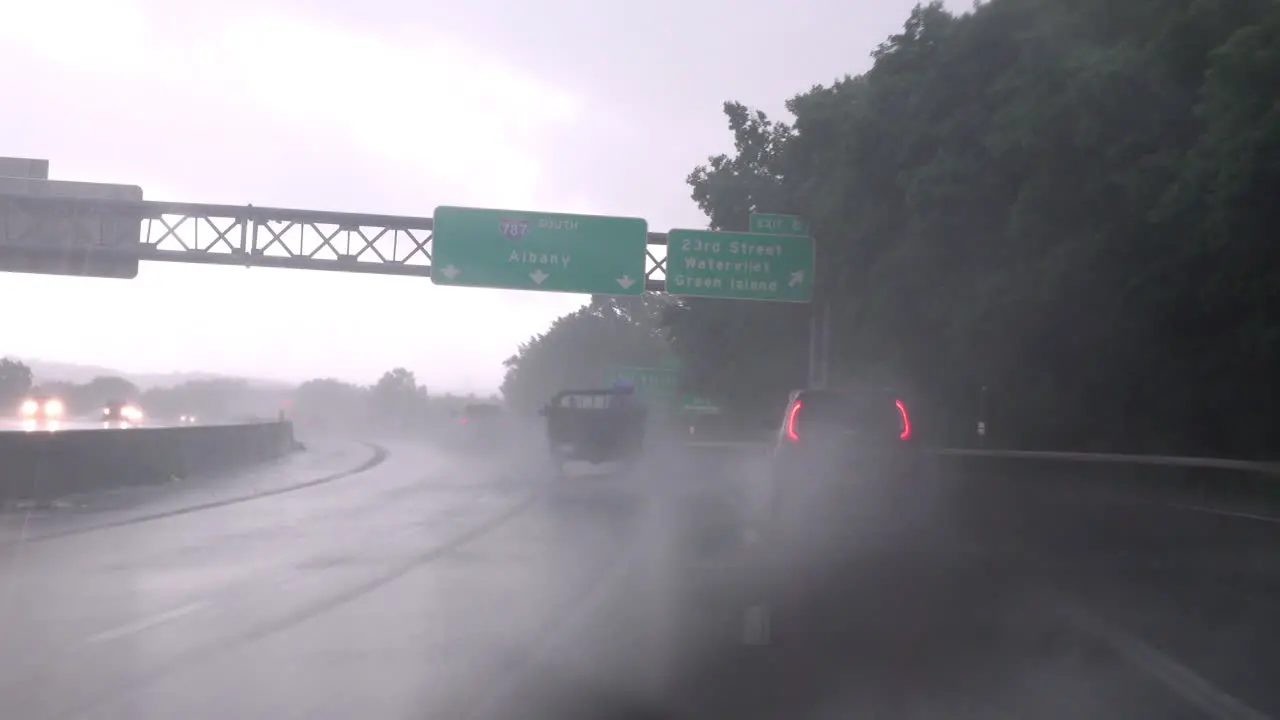 Driving on the highway in a heavy downpour