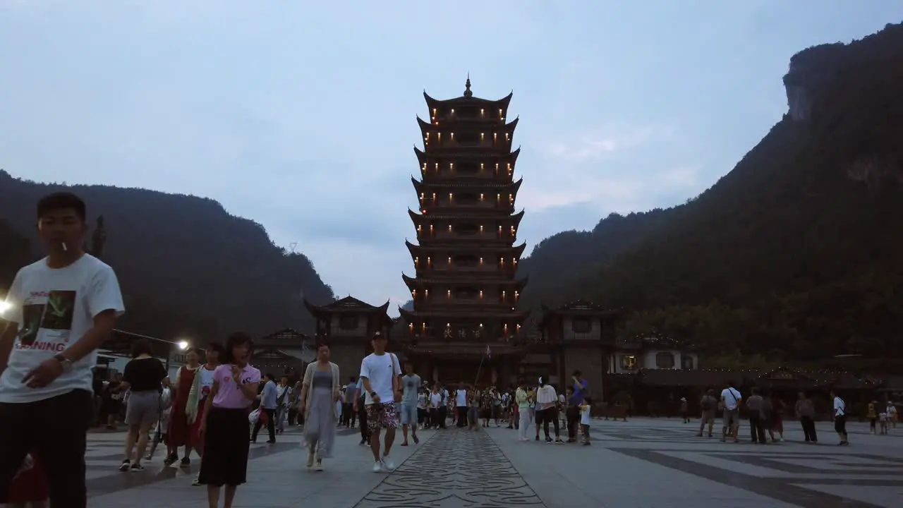 Wulingyuan China August 2019  Crowds of people leaving the Wulingyuan exit to the Zhangjiajie national park in the evening Hunan Province