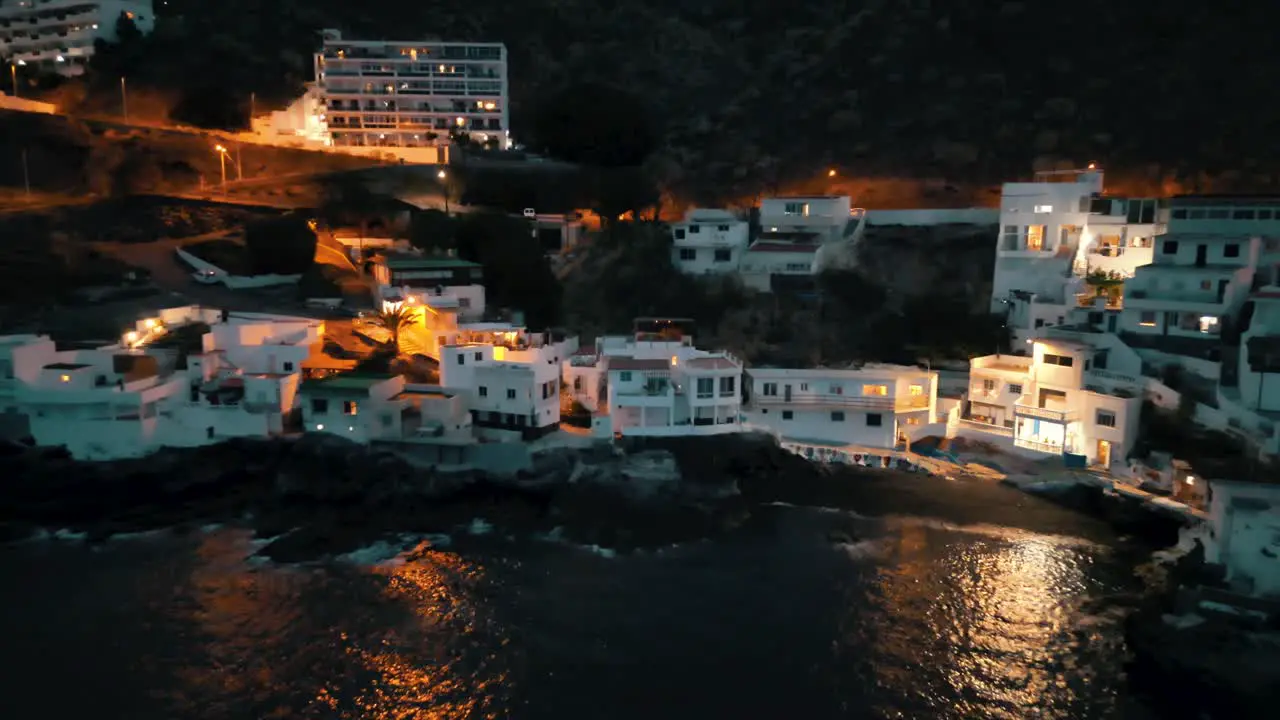 flying backwards in the night from a beautiful small fishermen village in Spain