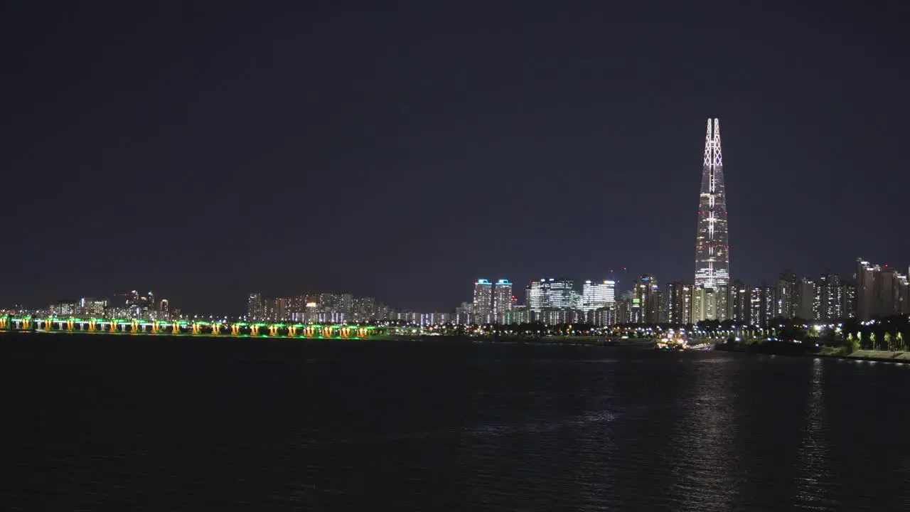 Night scene at capital city Seoul with famous landmark Lotte Tower at Han River