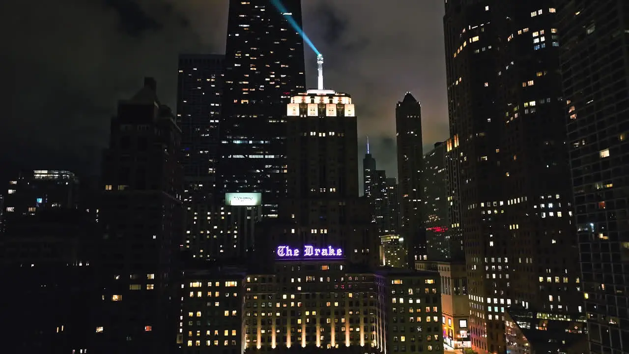 Aerial view rising in front of the Lindbergh Beacon on top of the the Drake hotel dusk in Chicago USA