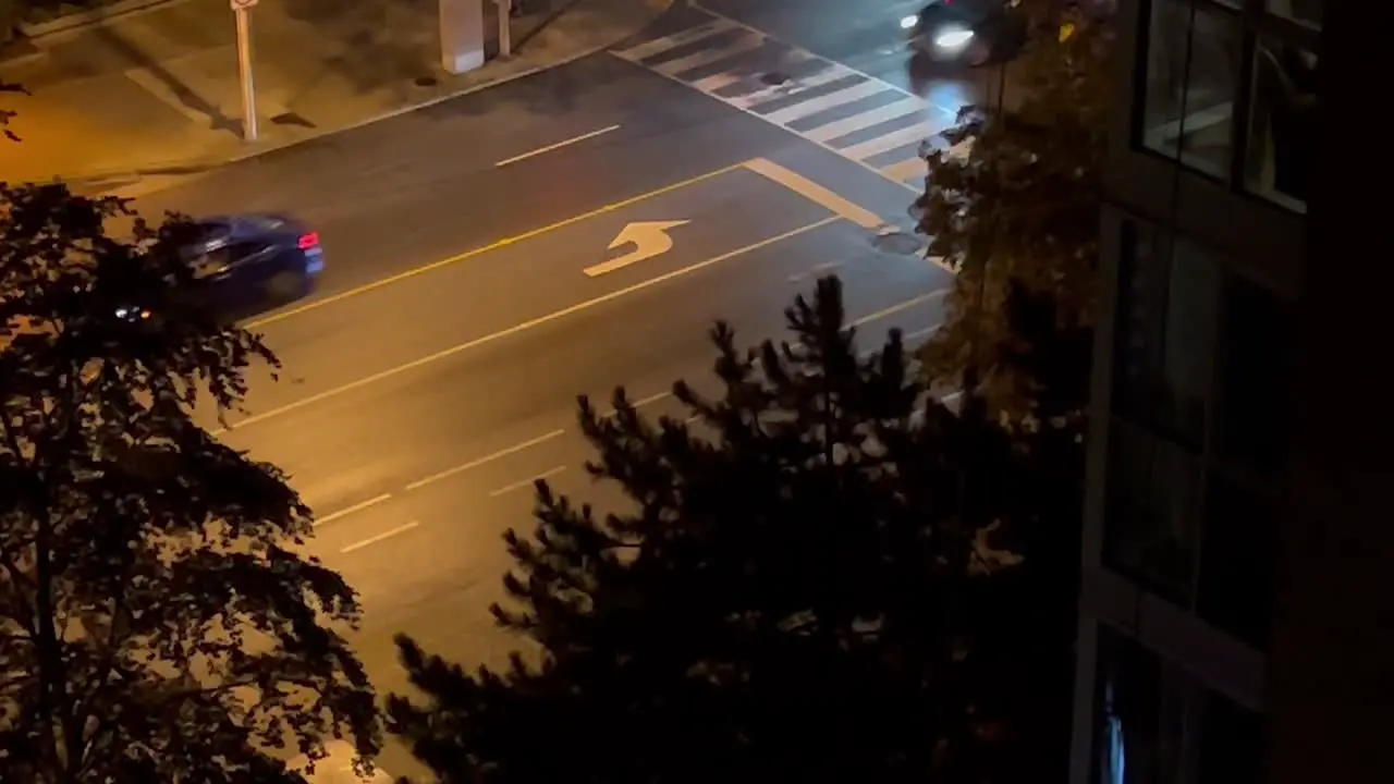 Cars Driving In The City Street At Night