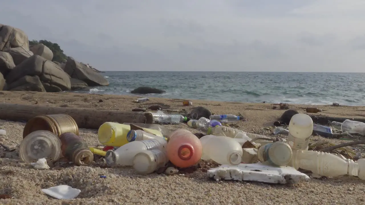 Rubbish piled up in the bush corner near beachfront steady pan moving to right 4K footage