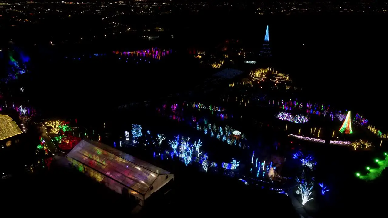 Christmas festival at a garden park aerial parallax view at nighttime