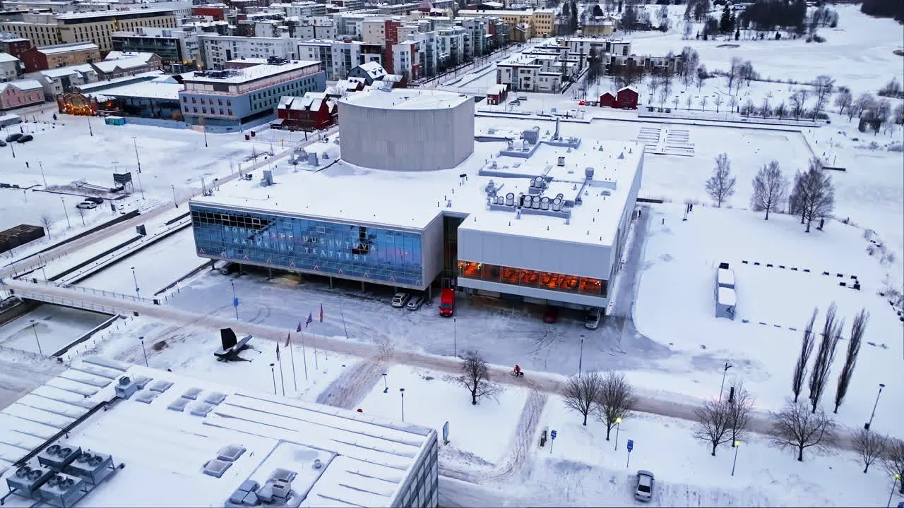 Aerial view descending in front of the Oulu Theatre winter morning in Finland