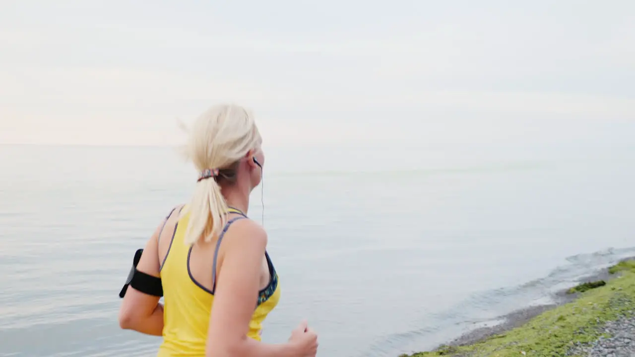 Woman Running by a Lake