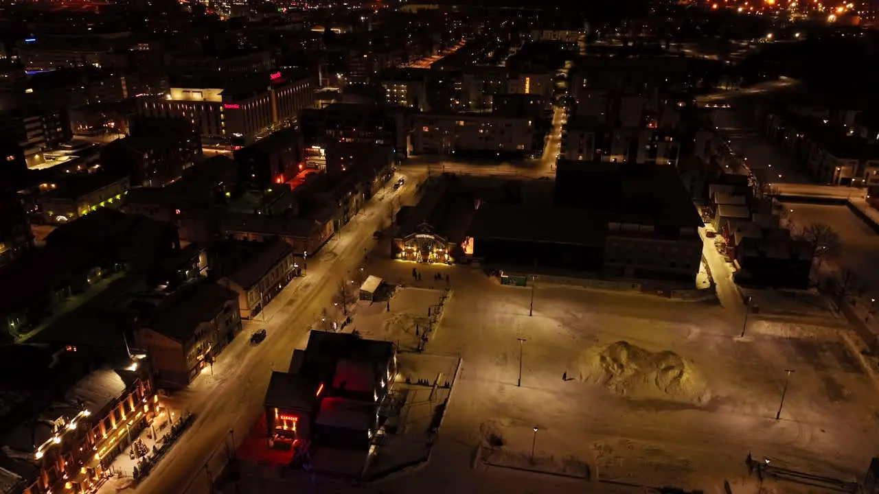 Aerial view tilting away from the Market hall winter evening in Oulu Finland