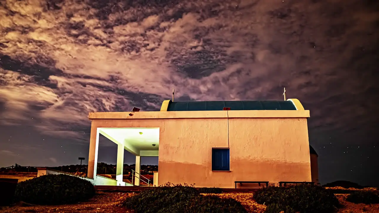 Timelapse of Cyprus Chapel under a Starry Sky with Cirrus Clouds Morphing Crafting a Magical and Surreal Animation