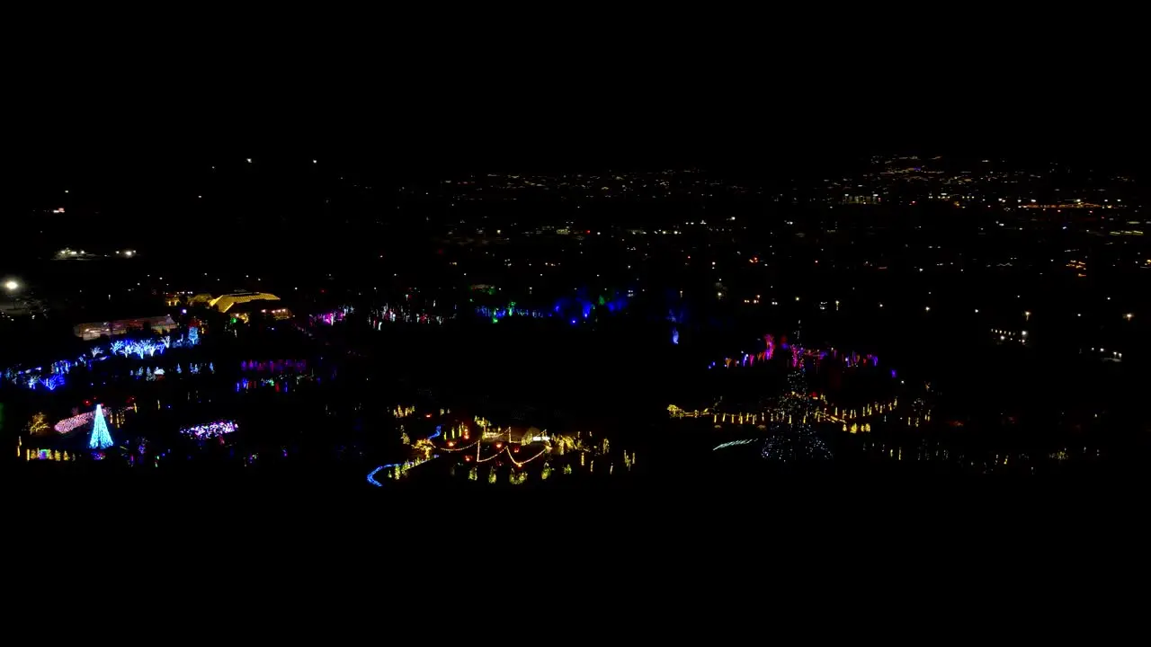 Festival of Christmas lights in a garden park aerial parallax view