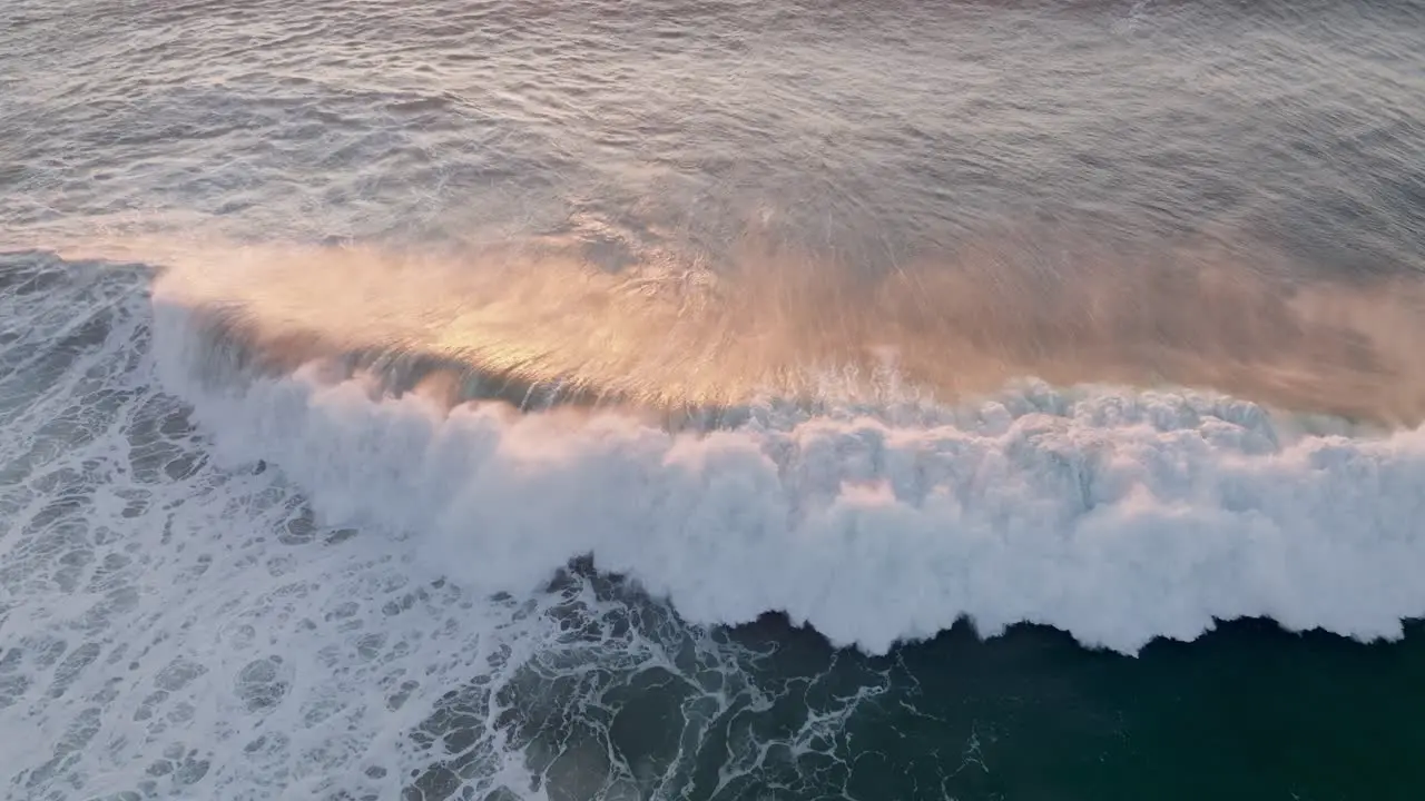 Big waves crashing at Nazare during sunset