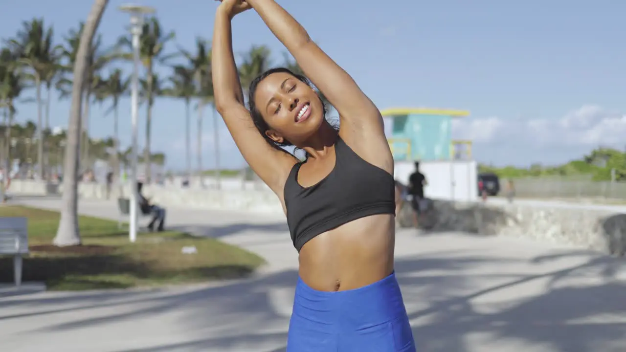 Sporty woman training in sunlight