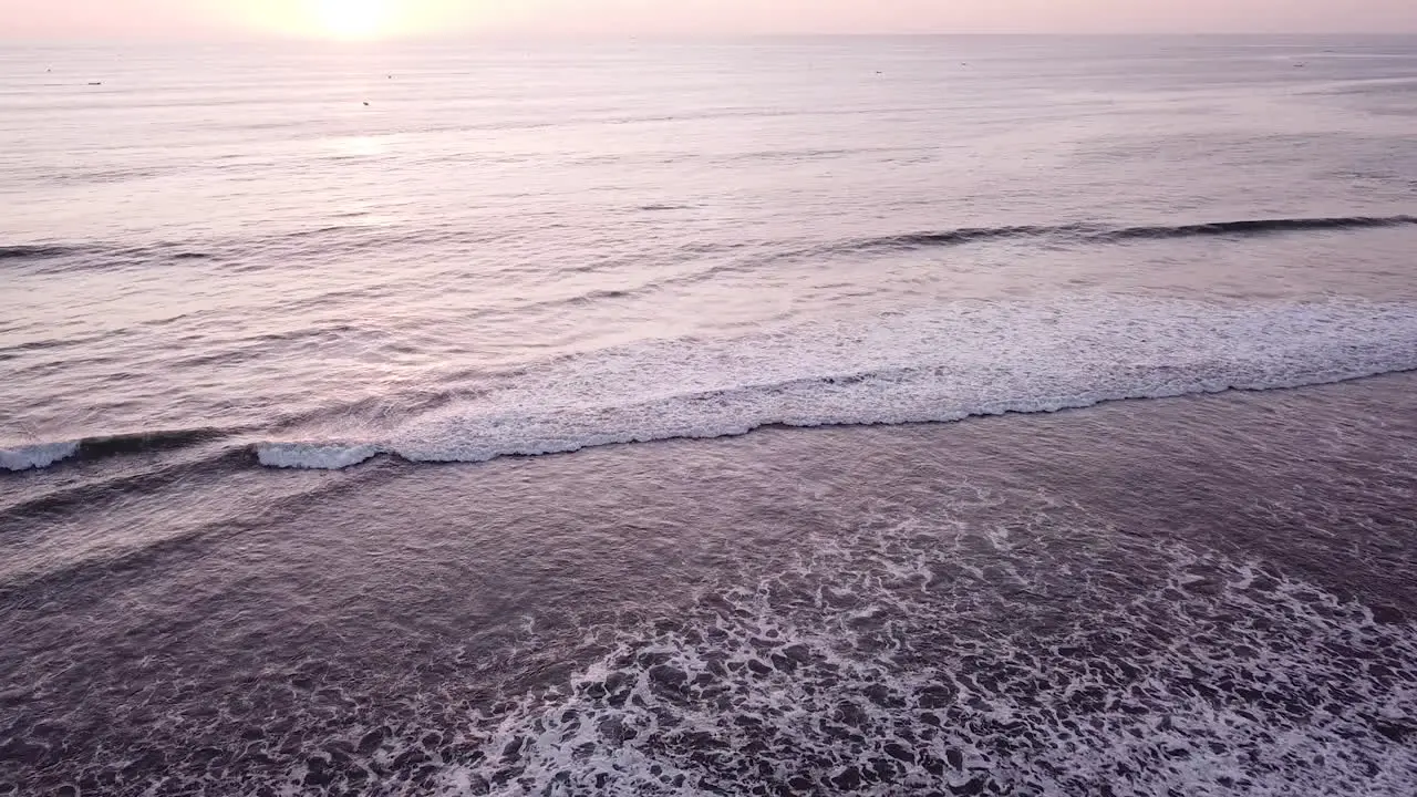 Scenic Ocean Waves Washing Sandy Shore Under Colorful Sky In Olon Beach Ecuador