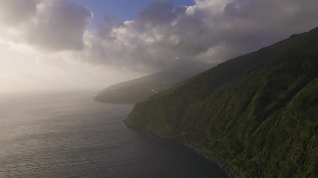 lush green dramatic cliffs of an island over the Atlantic ocean São Jorge island the Azores Portugal