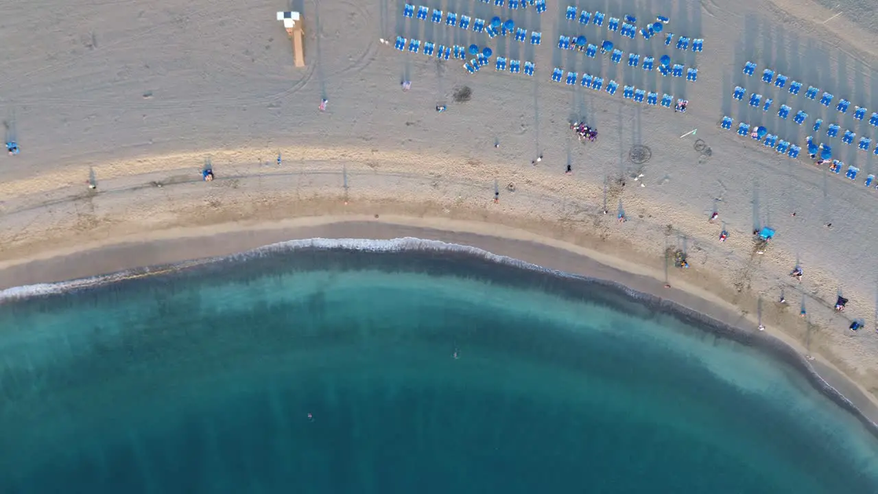 Sandy beach waves turquoise blue water Las Vistas beach Tenerife Costa Adeje