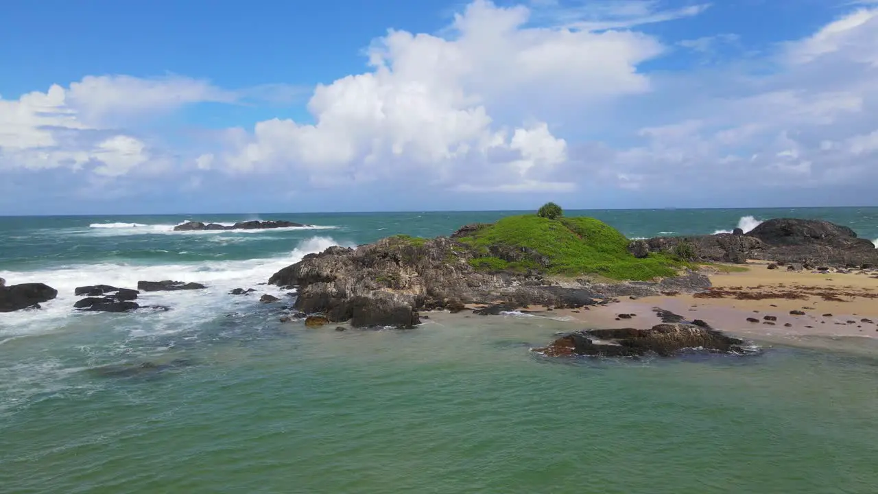 Green Headland With Splashing Waves On Rocks At Sawtell Beach In New South Wales Australia