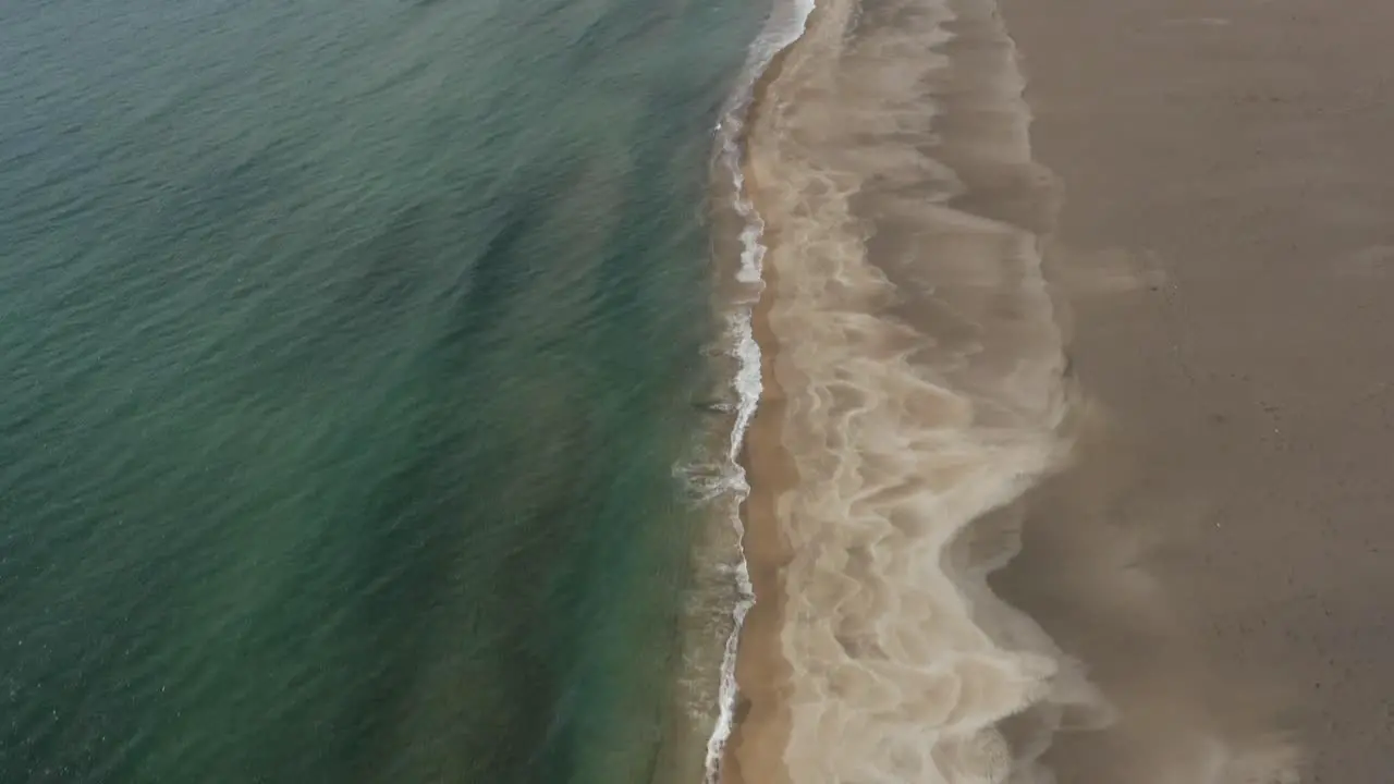 Stunning wild sandy coastline of Snæfellsnes Peninsula in Iceland drone tilt up