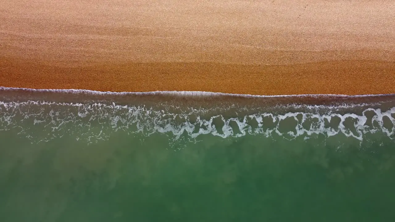 Folkstone Beach Birdseye View Dark Sand Meets the Sea Gradient sandy beach 4K