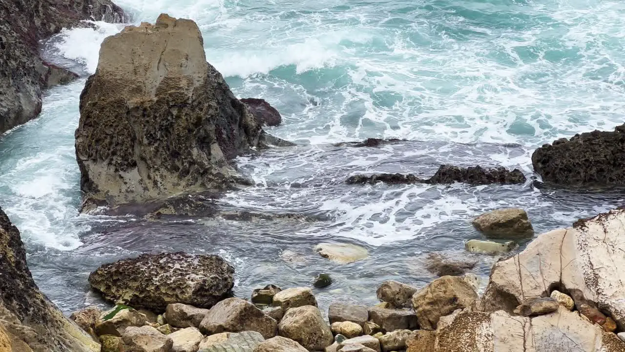 Cinematic slow motion shot of waves crashing agains rocks in Peniche Portugal Europe Slomo