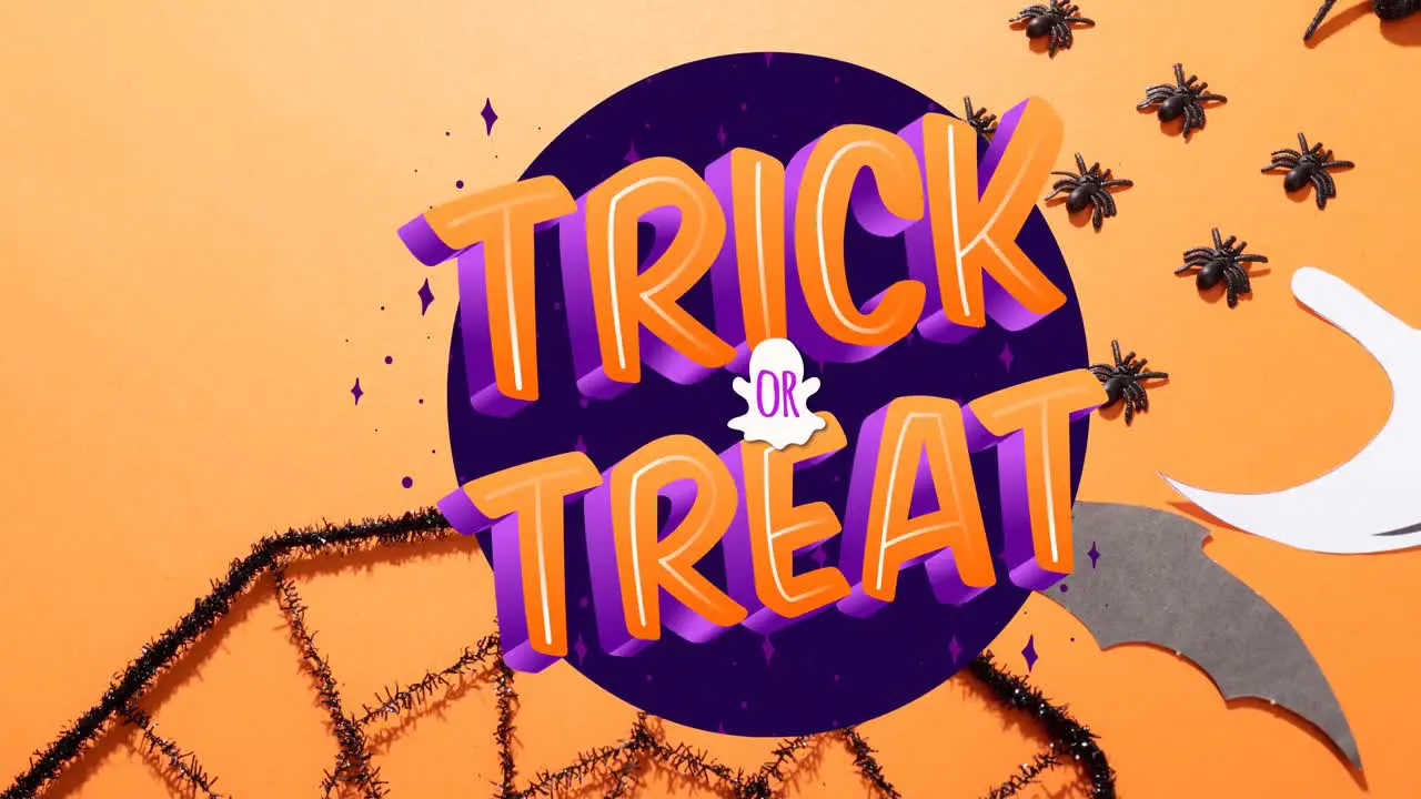 Animation of trick or treat text over spiders