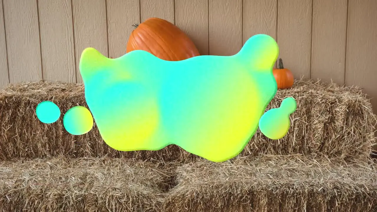 Animation of glowing blobs over pumpkins on straw