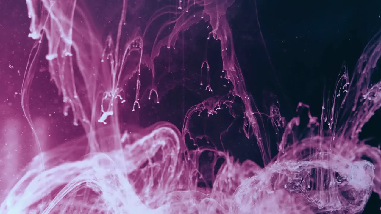 Cosmic powers flowing through space paint mixing with water pink and black