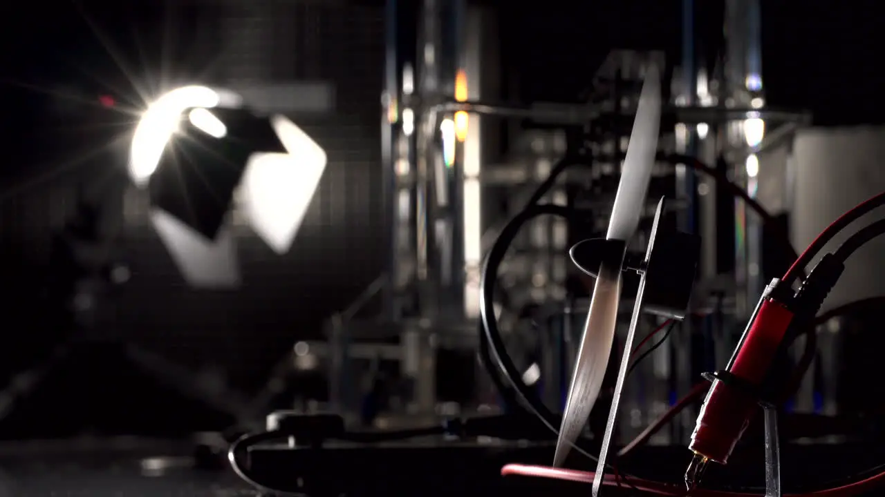 Small electric fan powered by the light seen in the background