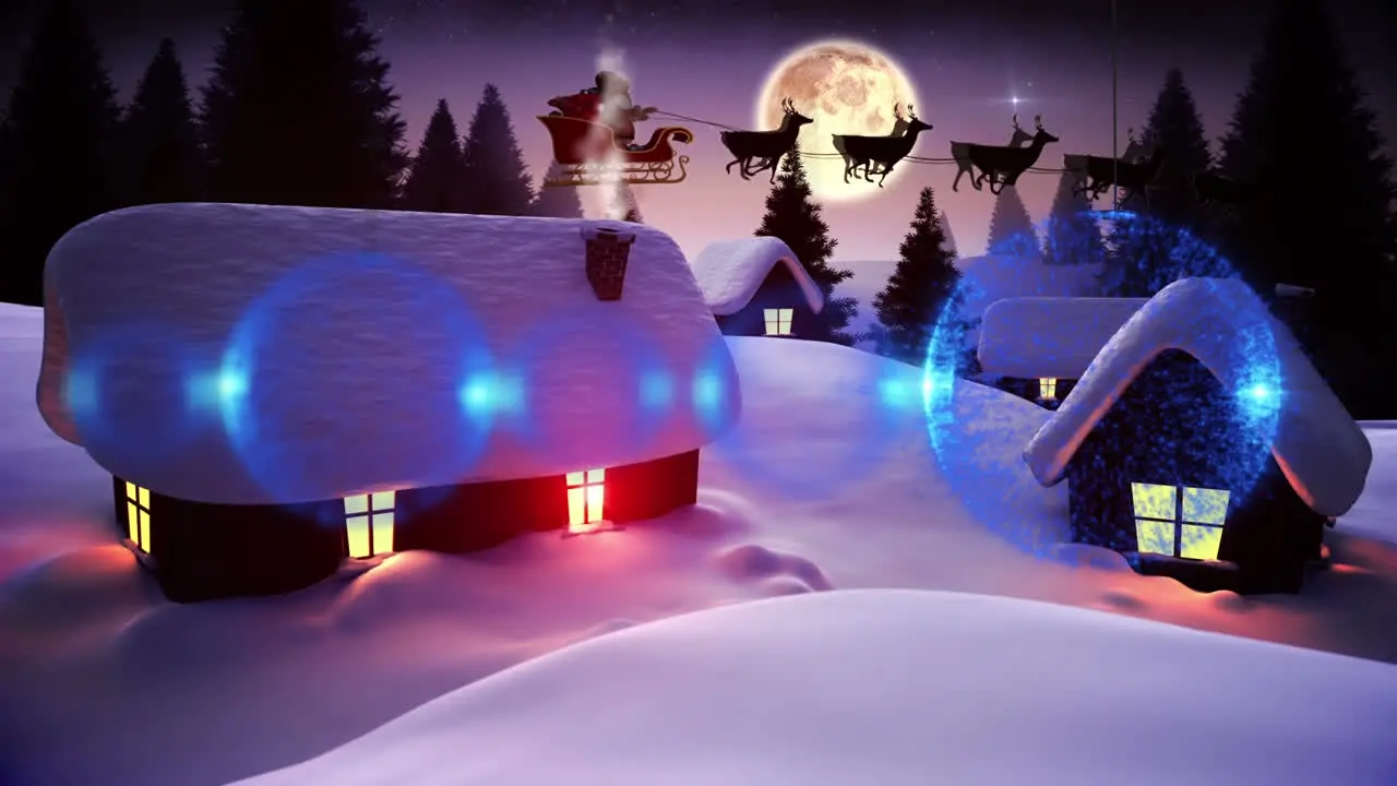 Blue bauble decorations hanging over houses and trees on winter landscape against moon in night sky